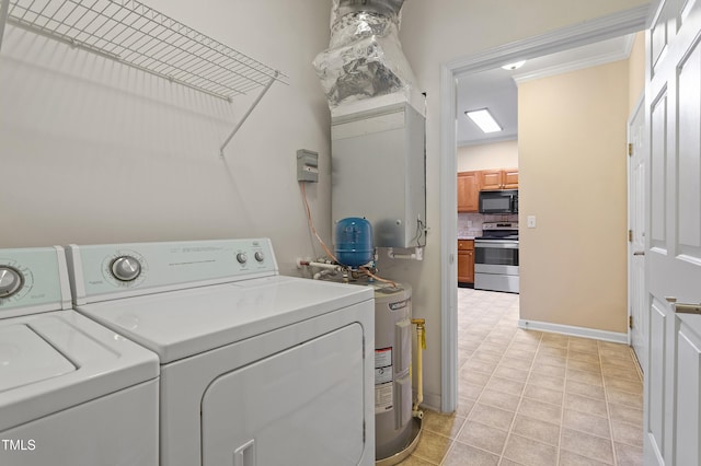 laundry area with washer and dryer, light tile patterned floors, and electric water heater