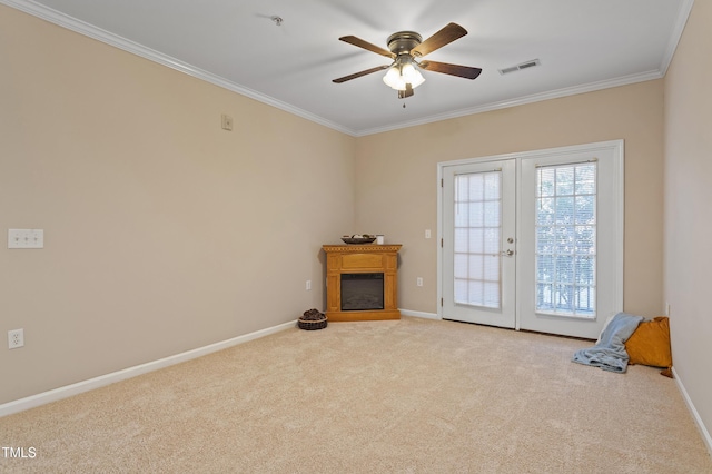 interior space featuring french doors, ceiling fan, and crown molding