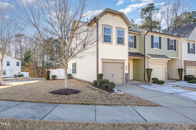 multi unit property featuring a garage