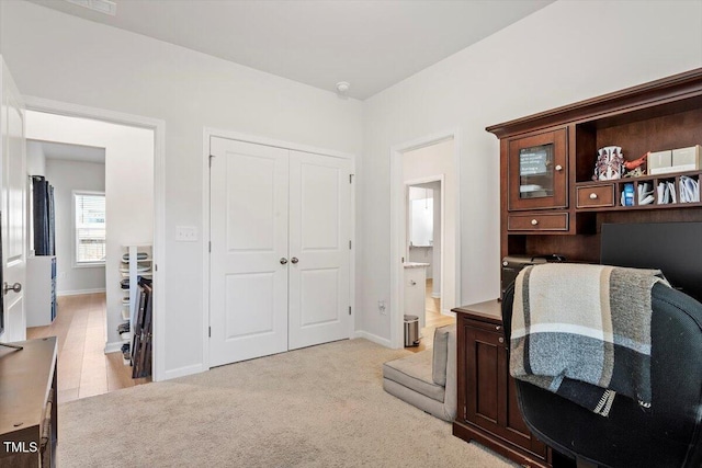 home office featuring carpet flooring and baseboards