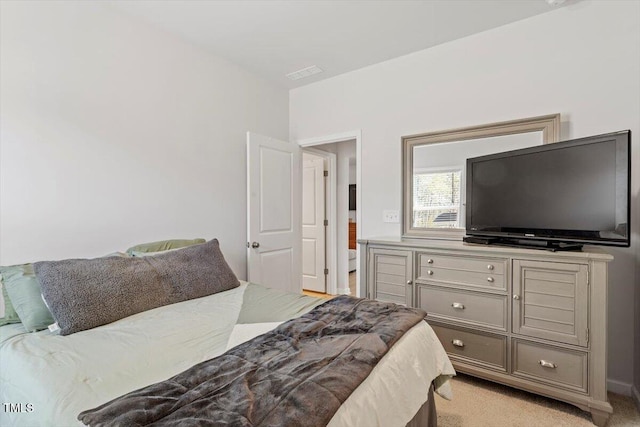 bedroom with light carpet and visible vents