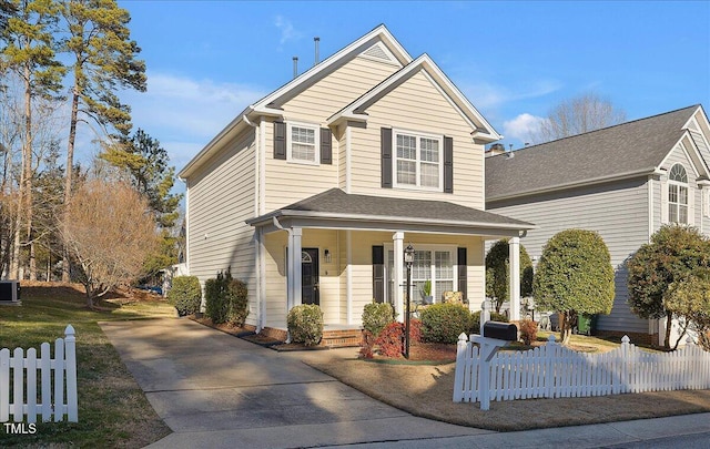 view of front of house with covered porch and central AC unit