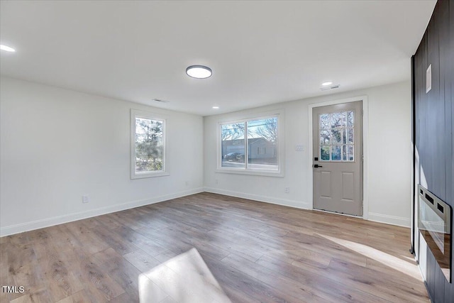 foyer with light hardwood / wood-style flooring