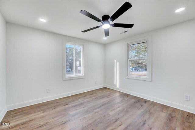 unfurnished room featuring ceiling fan and light hardwood / wood-style floors