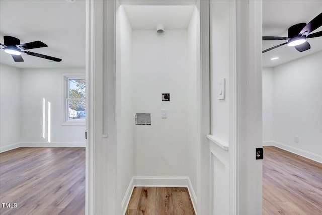 washroom featuring light hardwood / wood-style floors, ceiling fan, and hookup for a washing machine