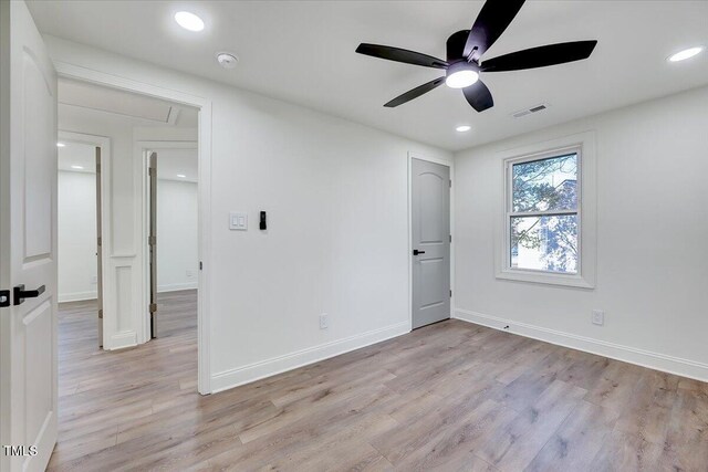 spare room with ceiling fan and light hardwood / wood-style flooring