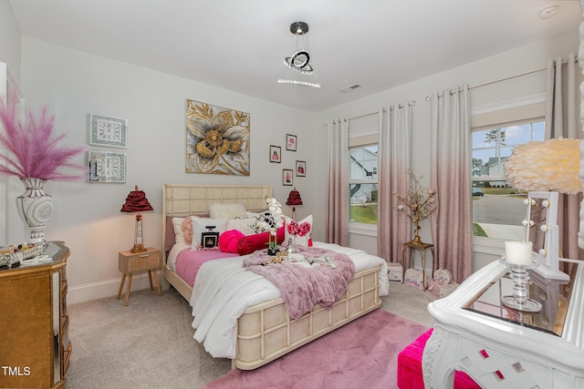 bedroom with light colored carpet