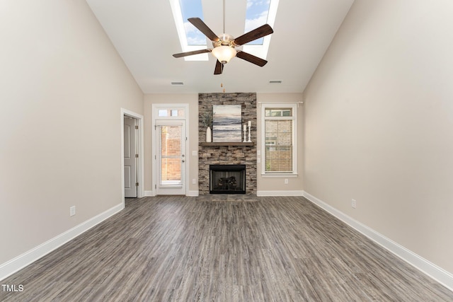 unfurnished living room with high vaulted ceiling, a fireplace, hardwood / wood-style floors, and ceiling fan