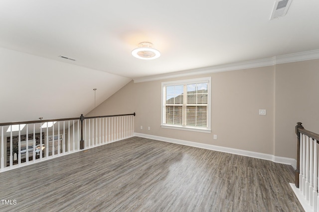 bonus room featuring vaulted ceiling and dark hardwood / wood-style floors