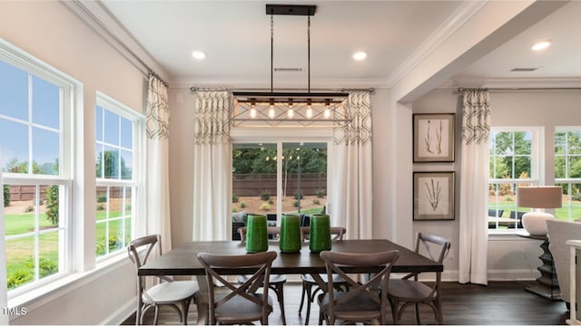 dining area with crown molding and dark wood-type flooring