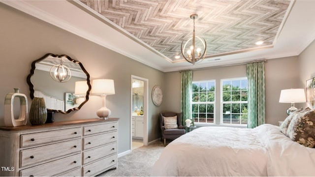 bedroom with a raised ceiling, connected bathroom, light colored carpet, and ornamental molding