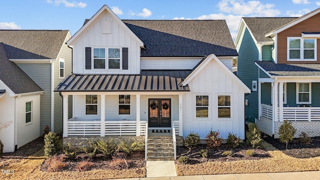 modern farmhouse with french doors and a porch