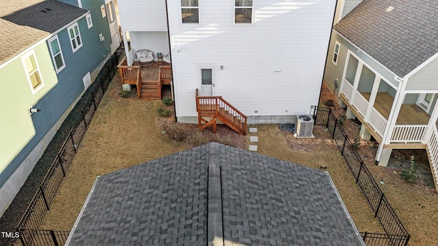 rear view of property with central air condition unit