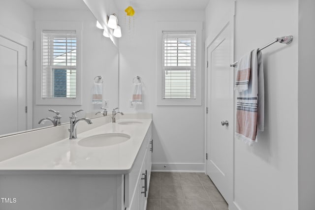 bathroom with plenty of natural light, tile patterned flooring, and vanity