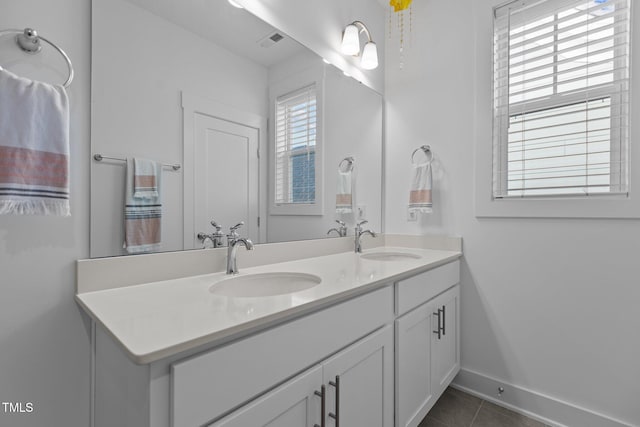 bathroom with vanity and tile patterned flooring