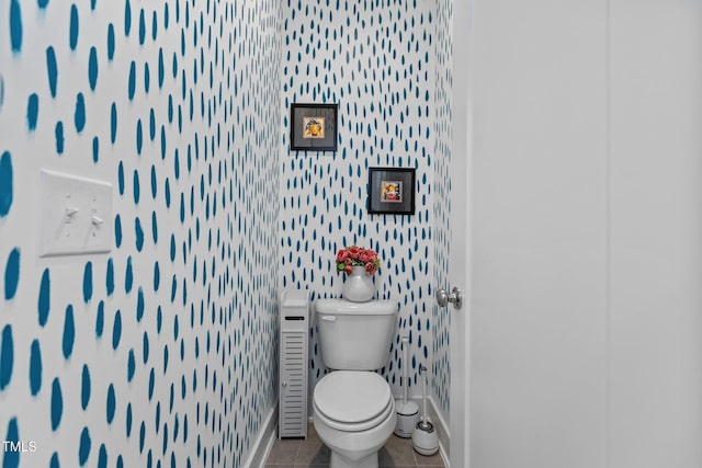 bathroom with tile patterned flooring and toilet