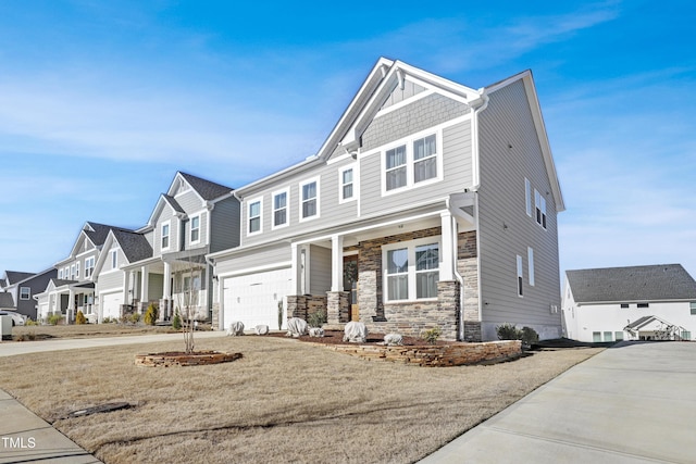 view of front of property with a front lawn and a garage