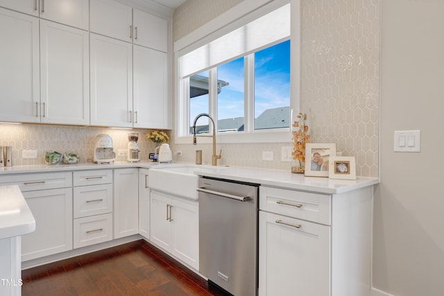 kitchen with white cabinetry, dark hardwood / wood-style floors, backsplash, dishwasher, and sink