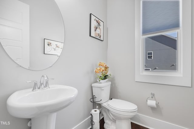 bathroom featuring toilet and sink