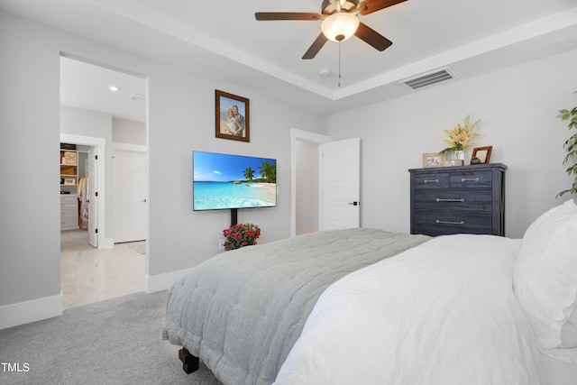 bedroom with ceiling fan and light colored carpet