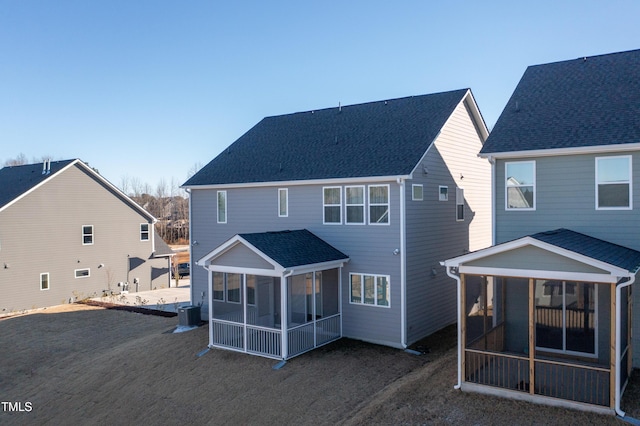 back of property featuring a sunroom and central air condition unit