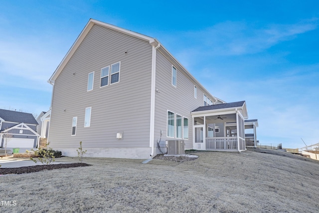 rear view of property featuring covered porch, central AC, and ceiling fan