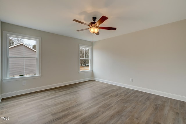 spare room with ceiling fan and light hardwood / wood-style floors