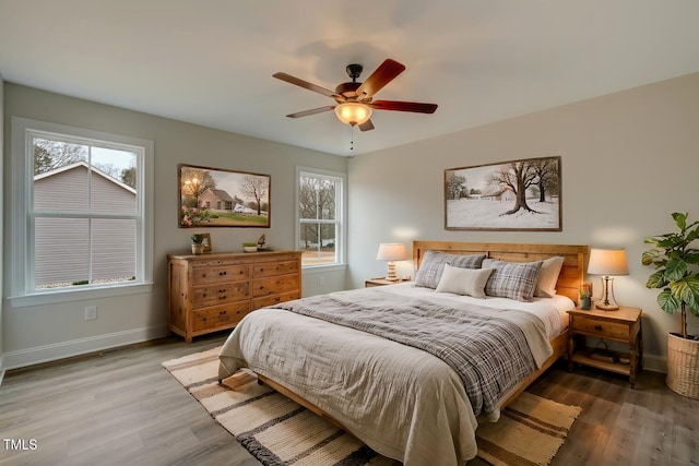 bedroom featuring hardwood / wood-style floors and ceiling fan