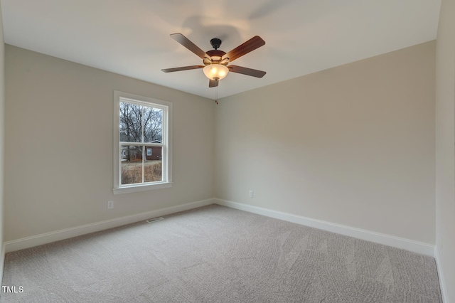 carpeted empty room with ceiling fan