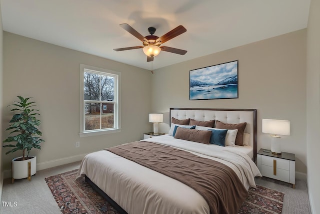 bedroom with light carpet and ceiling fan