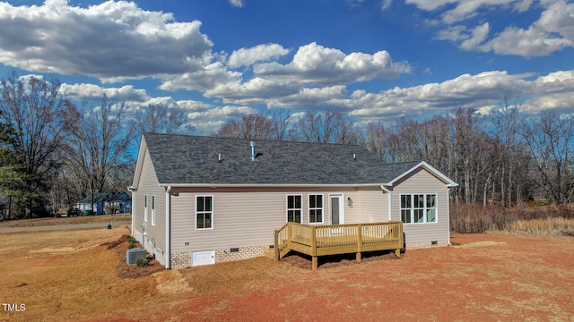 back of house with central AC unit and a deck