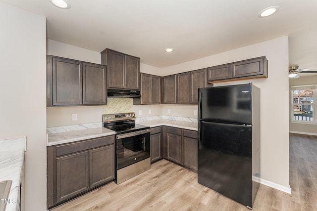 kitchen featuring stainless steel electric stove, black fridge, light hardwood / wood-style flooring, ceiling fan, and dark brown cabinets