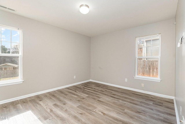 spare room featuring hardwood / wood-style flooring