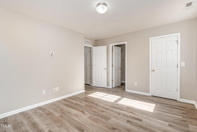 unfurnished bedroom with light hardwood / wood-style floors