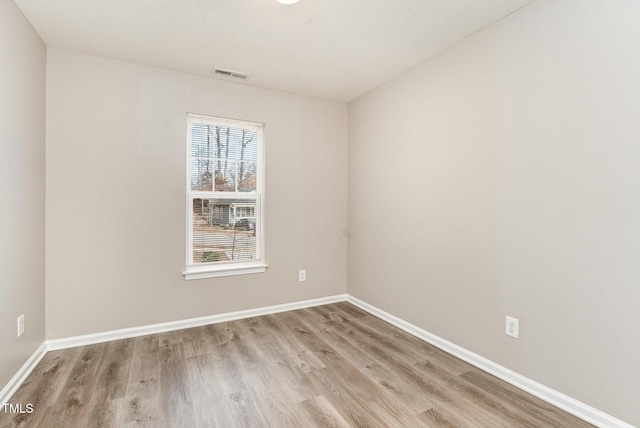 spare room with light hardwood / wood-style floors