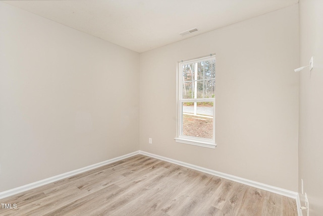 unfurnished room with light hardwood / wood-style floors