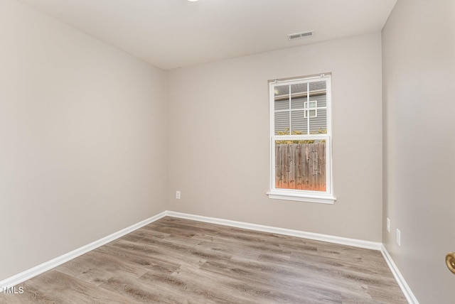 spare room featuring light hardwood / wood-style flooring