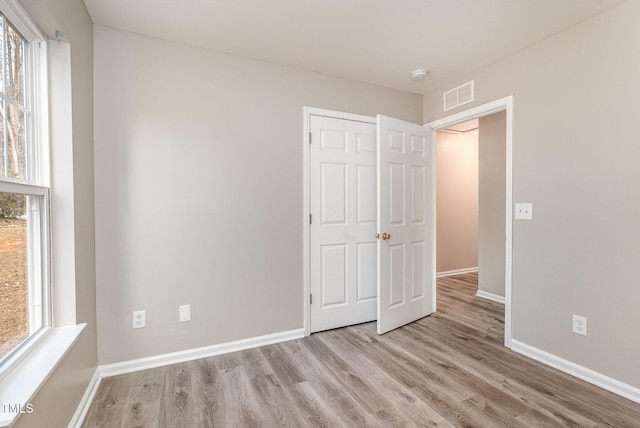 unfurnished bedroom featuring light hardwood / wood-style floors