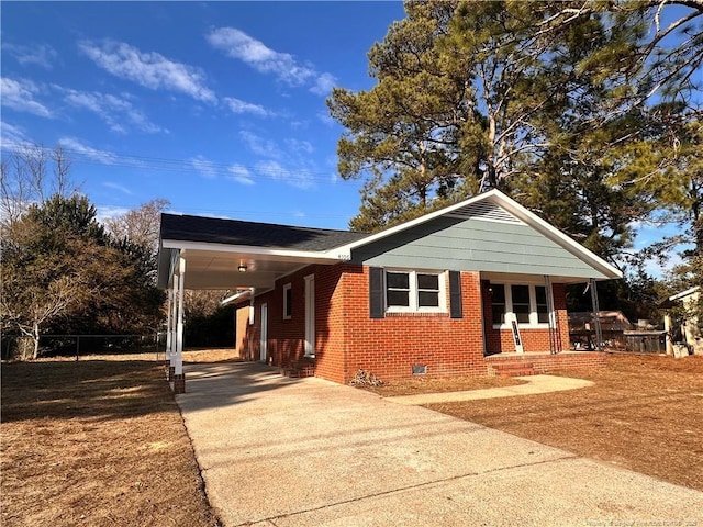 view of front of property featuring a carport and covered porch