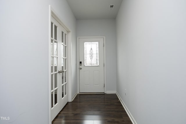 entryway featuring dark hardwood / wood-style flooring and french doors