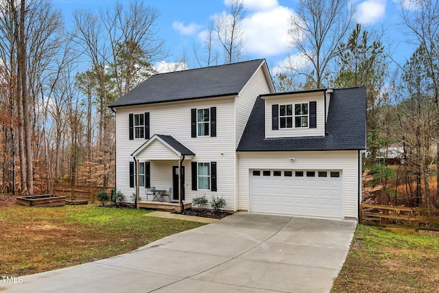 view of front of property featuring a garage, covered porch, and a front yard