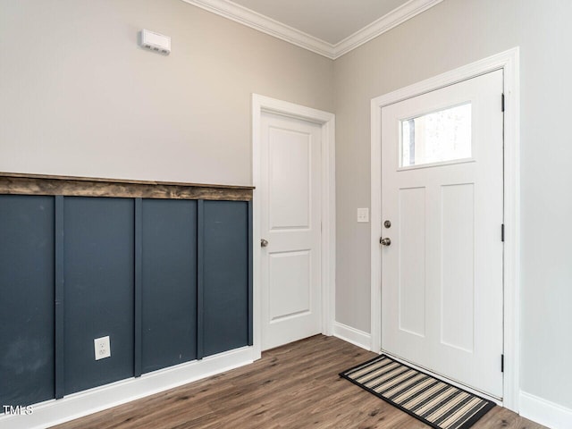 entrance foyer featuring dark wood-type flooring and crown molding