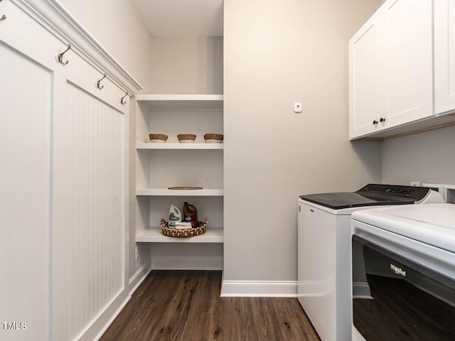 clothes washing area featuring washer and dryer, cabinets, dark hardwood / wood-style floors, and built in features