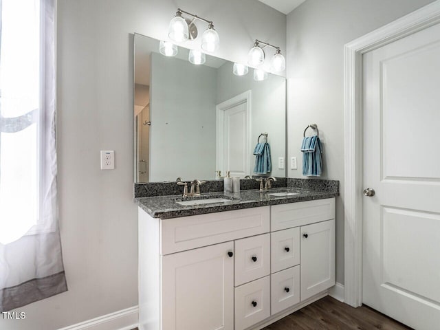 bathroom featuring hardwood / wood-style flooring and vanity