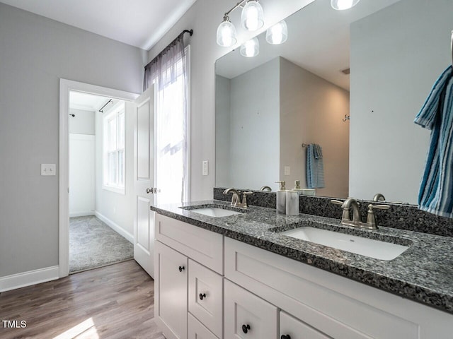 bathroom featuring hardwood / wood-style flooring and vanity