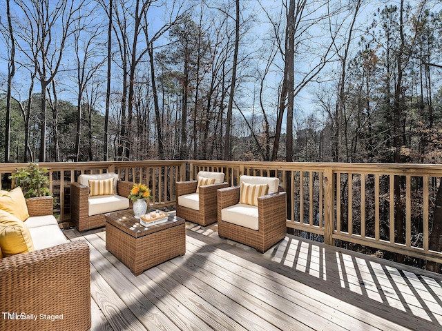 wooden deck featuring outdoor lounge area