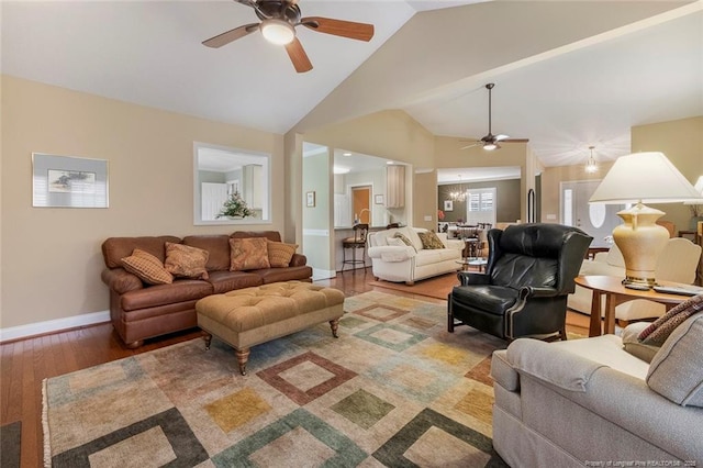 living room featuring hardwood / wood-style flooring, ceiling fan, and lofted ceiling