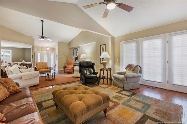 living room featuring hardwood / wood-style flooring, vaulted ceiling, plenty of natural light, and ceiling fan