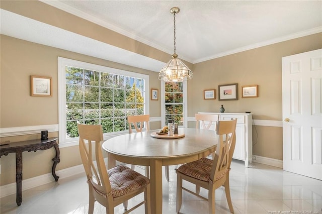 tiled dining area featuring an inviting chandelier, plenty of natural light, and ornamental molding