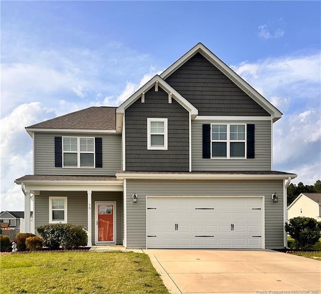 view of front facade featuring a garage and a front lawn